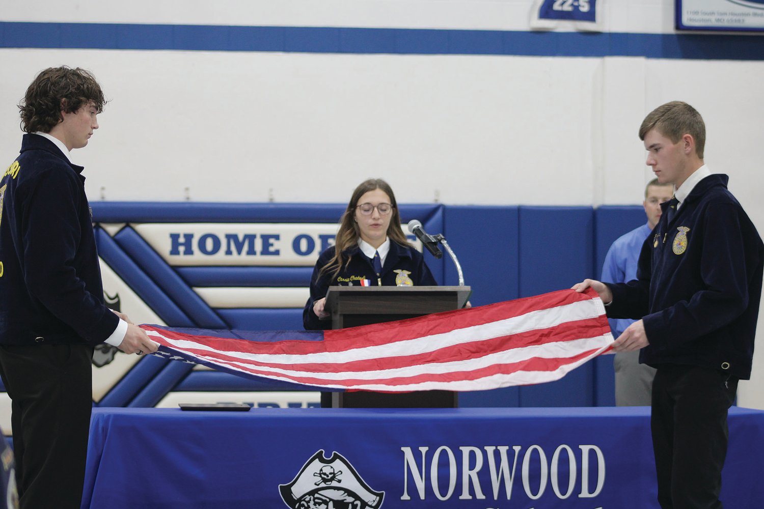 Justin Chadwell, Cassie Chadwell and Christopher Edwards during a Flag Folding Ceremony in Norwood.